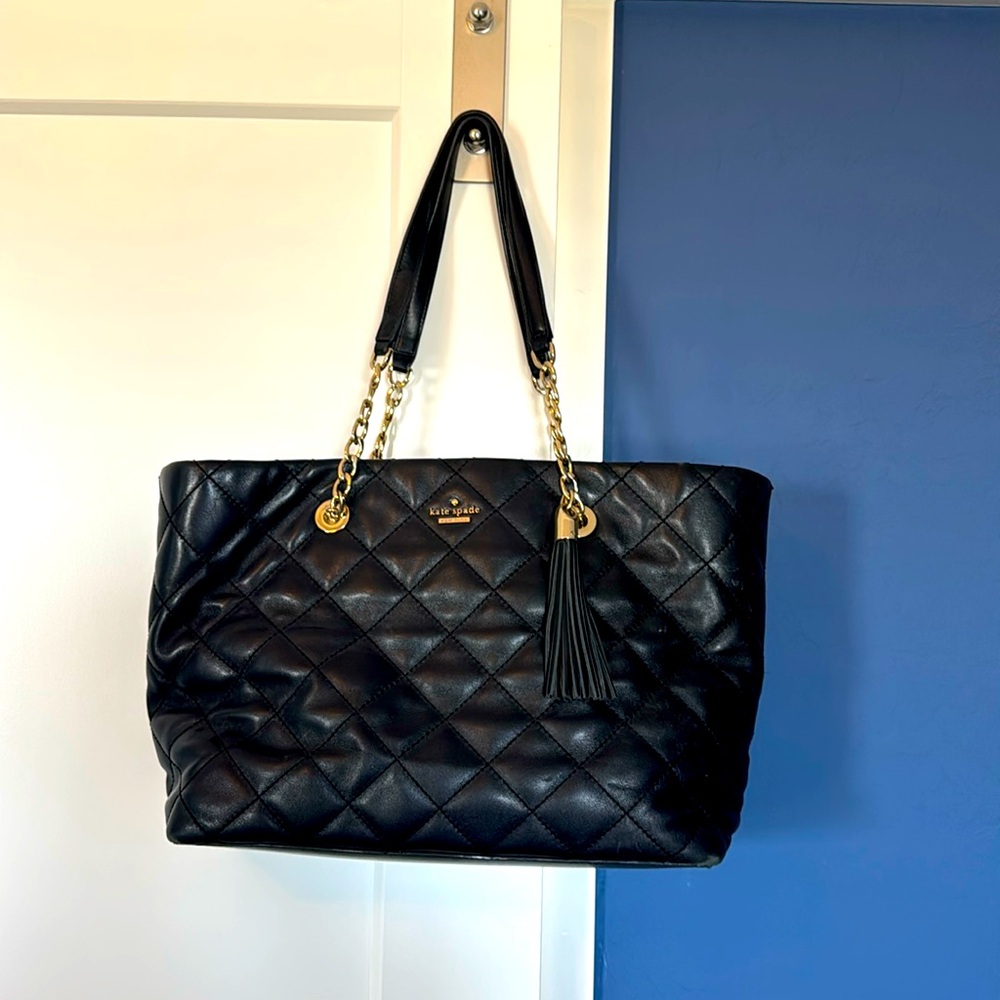 Kate spade tote purse, worn with slight stains on the inside and bottom of bag